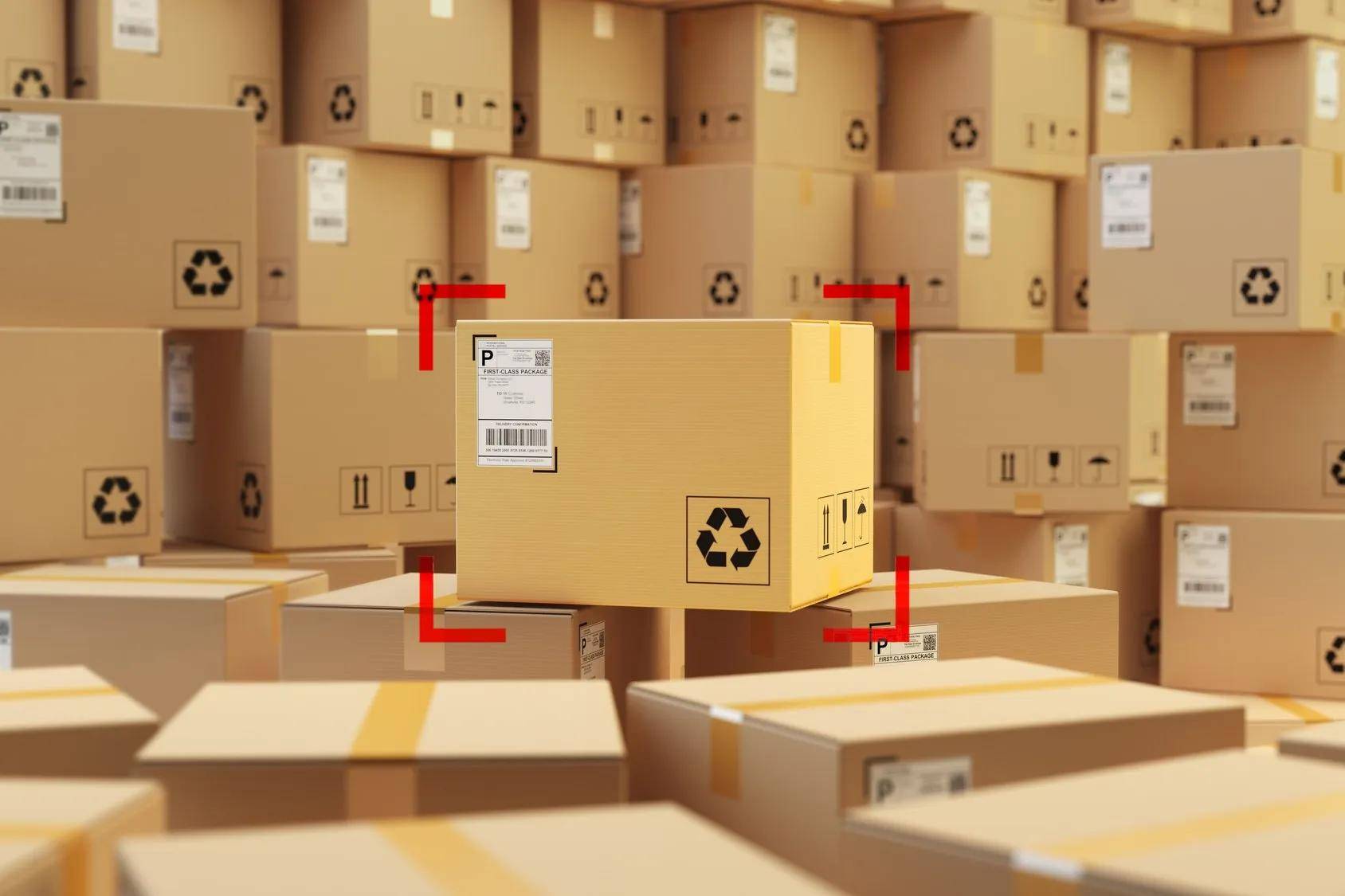 A bunch of cardboard boxes are stacked on top of each other in a warehouse.